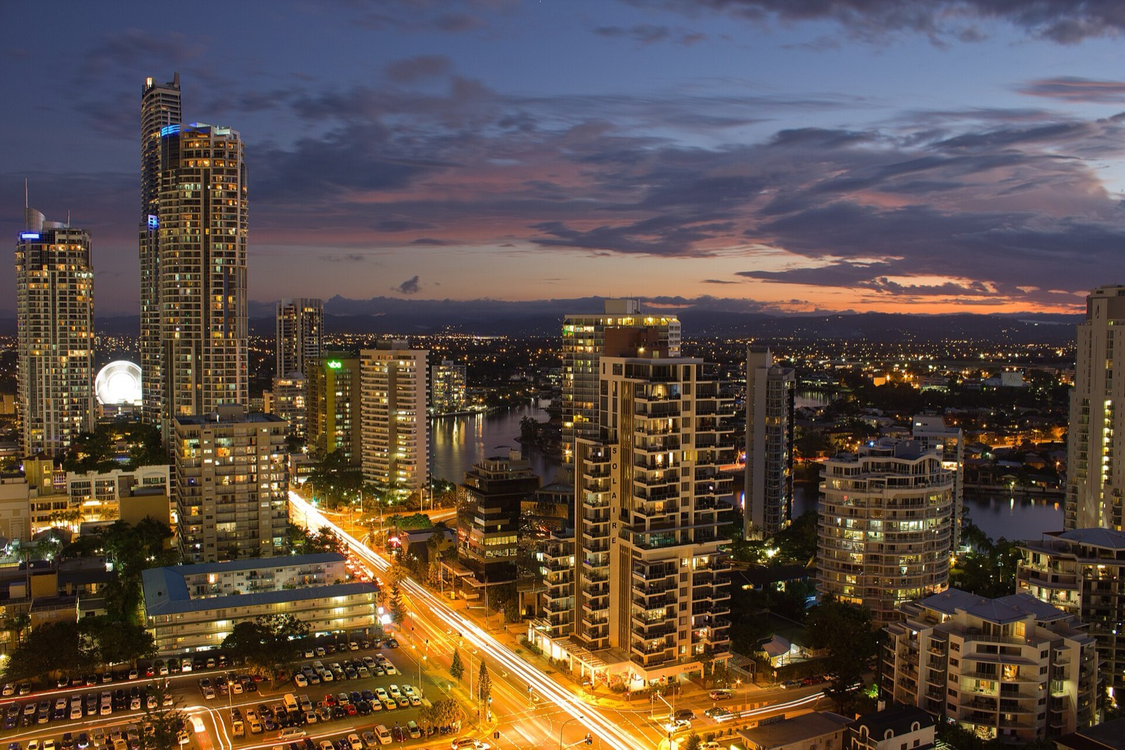 The Gold Coast at dusk, towers lit along the Nerang River